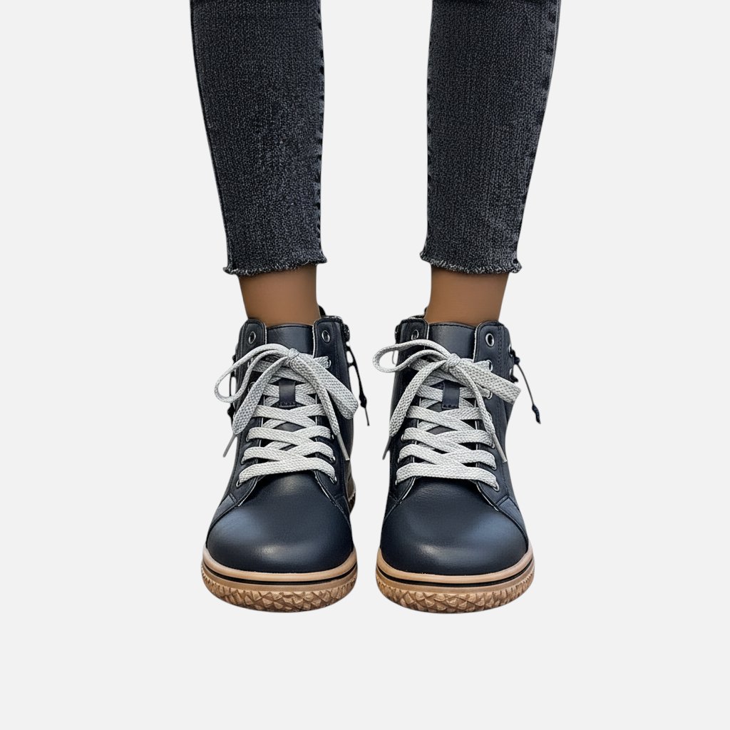 Luna Moda EDUARDA black leather ankle boots with grey laces and a textured tan sole worn with dark grey jeans
