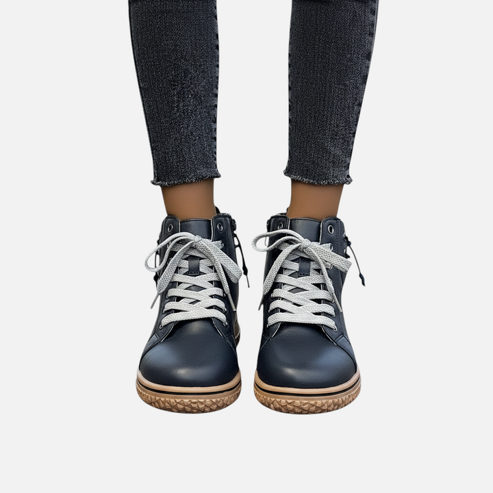 Luna Moda EDUARDA black leather ankle boots with grey laces and a textured tan sole worn with dark grey jeans