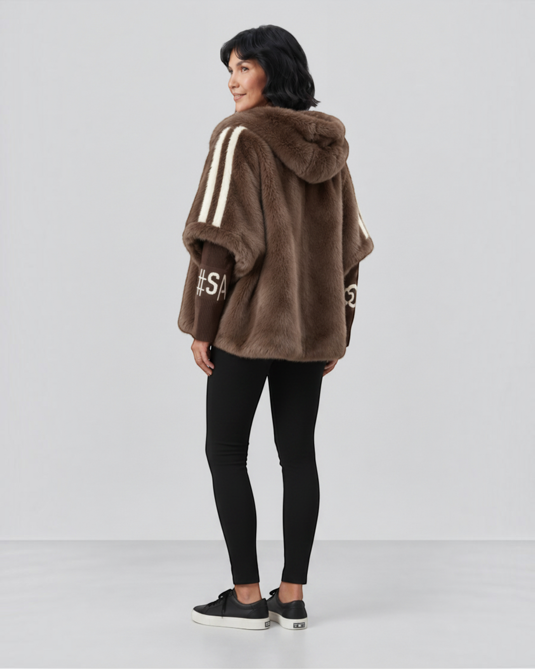 Luna Moda brown hooded jacket with white striped sleeves and text detail, worn by a woman with black leggings.