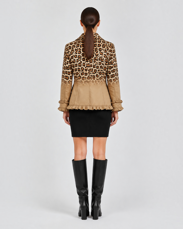 Luna Moda Emma blazer with leopard ombre print, ruffled hem, and cuffs, worn with a black skirt and knee-high boots.