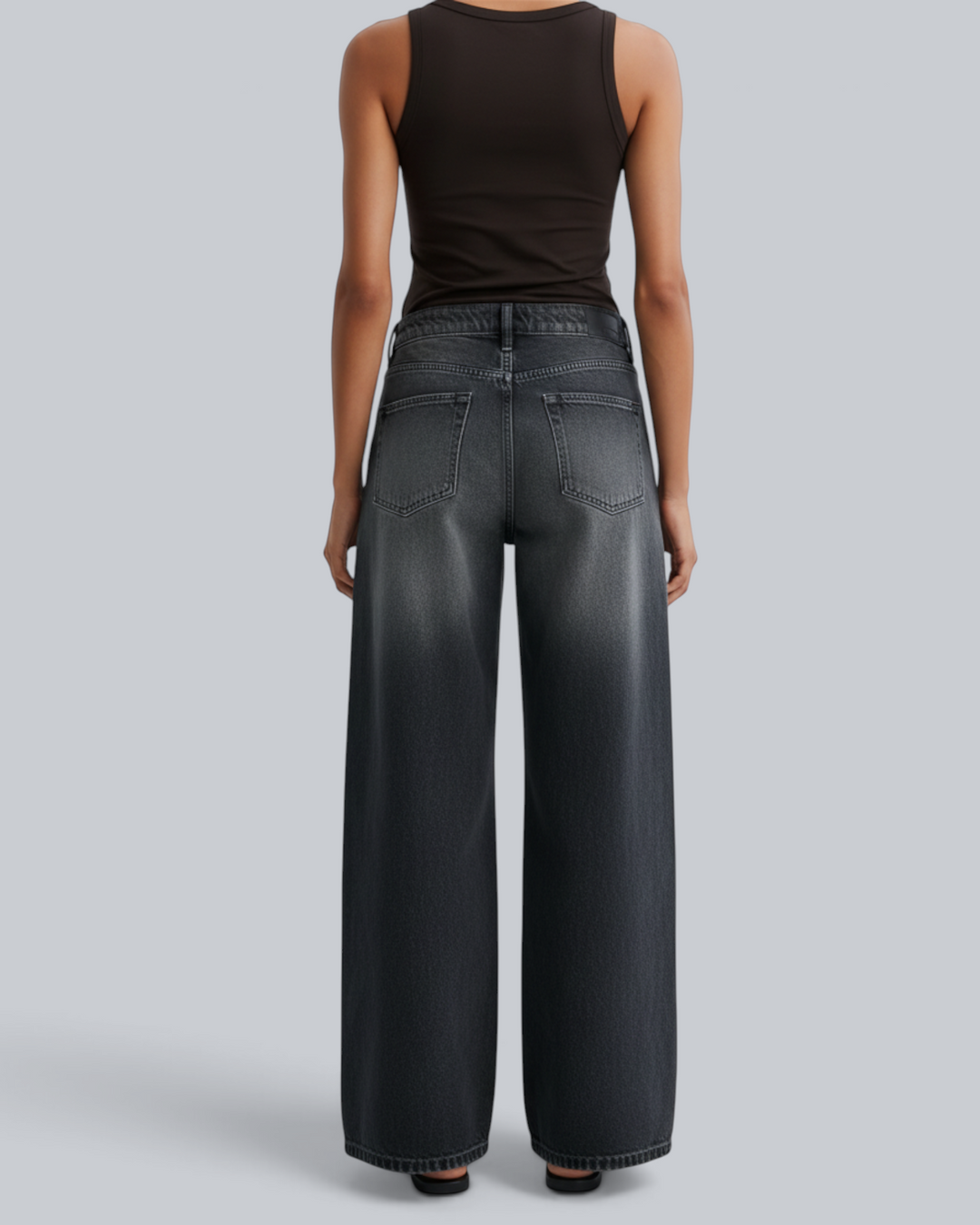 Luna Moda FULVIA high-waisted baggy jeans in a vintage washed black denim with a relaxed wide-leg fit, back view.