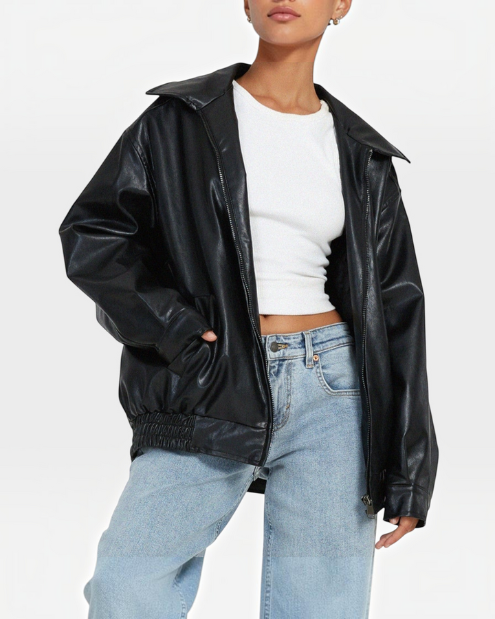Luna Moda black faux leather jacket with a relaxed fit, featuring a collar and zip closure worn over a white top.