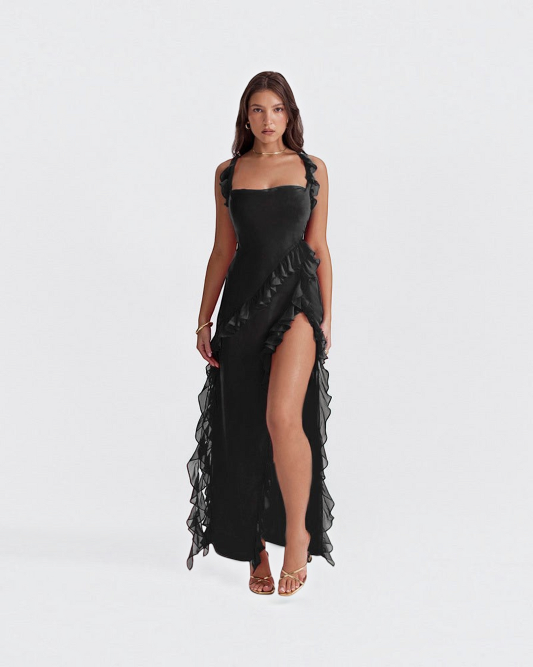 Luna Moda Andrea black maxi dress with ruffled straps, high side slit, and flowing silhouette on a model.