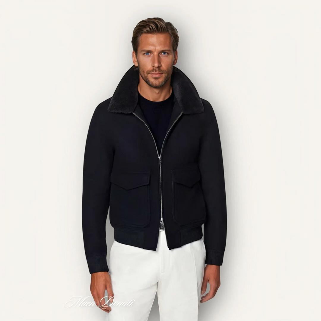 Luna Moda black bomber jacket in vegan wool blend with a detachable shearling collar worn by a male model.