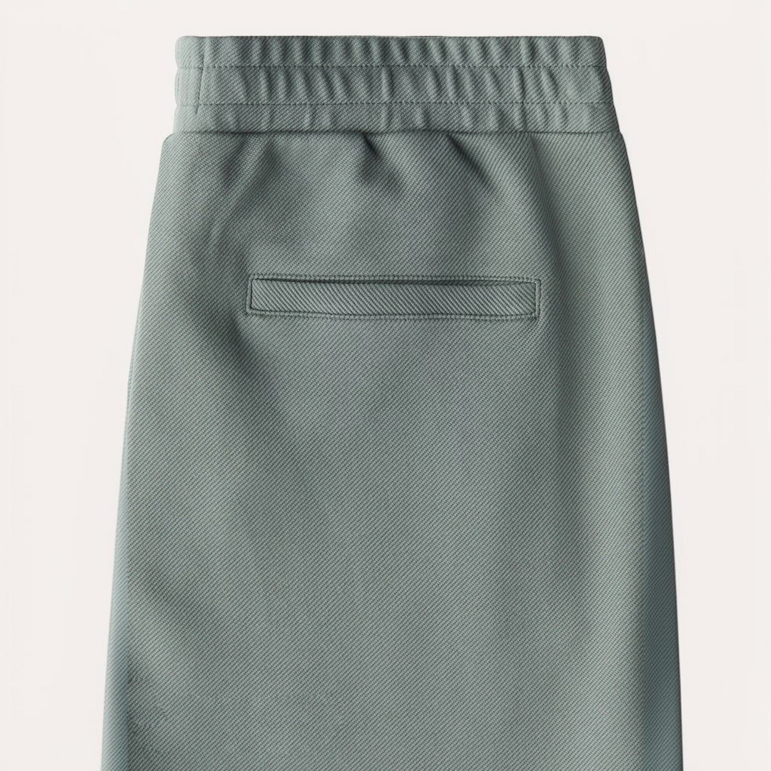 Luna Moda GIACOMO sage green regular fit trousers with wide leg, elasticated waistband, and back welt pocket detail.