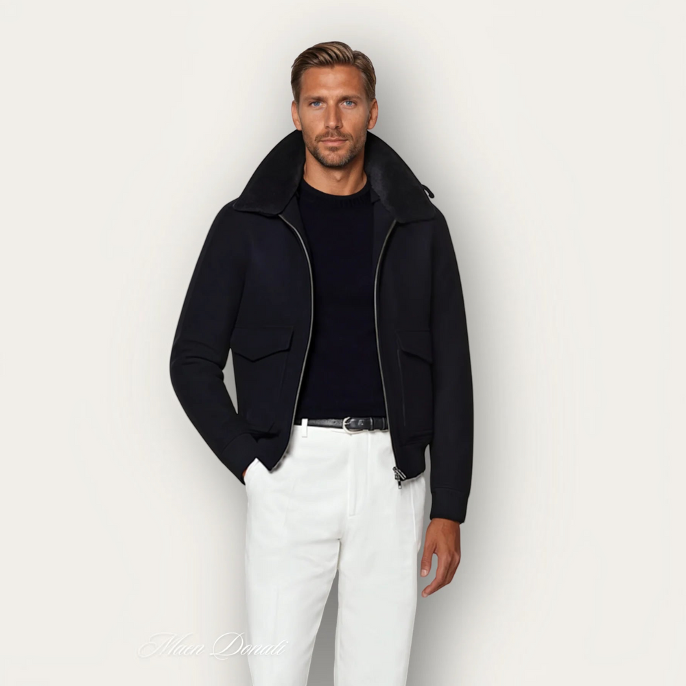 Luna Moda black bomber jacket in vegan wool blend with a detachable shearling collar worn by a male model.