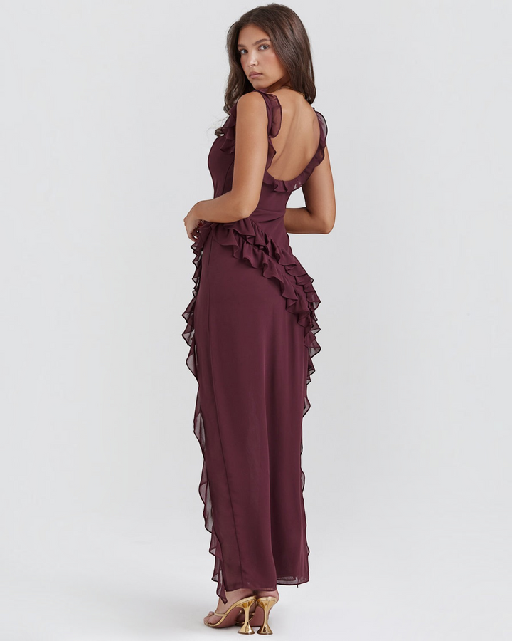 Luna Moda Andrea burgundy maxi dress with ruffled trim and open back worn by a model in studio