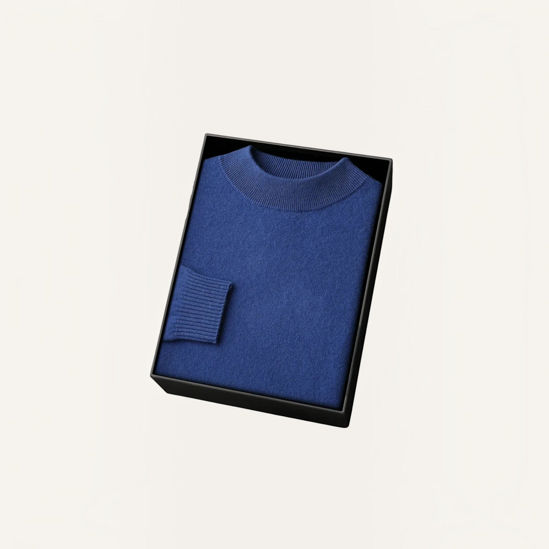 Luna Moda blue cashmere and wool blend sweater with ribbed collar and cuffs, neatly folded in a black gift box.