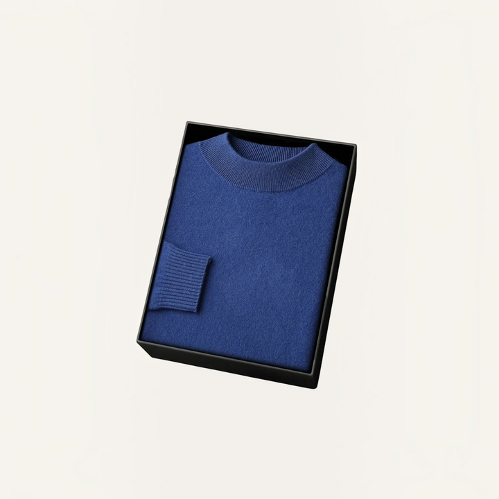 Luna Moda blue cashmere and wool blend sweater with ribbed collar and cuffs, neatly folded in a black gift box.