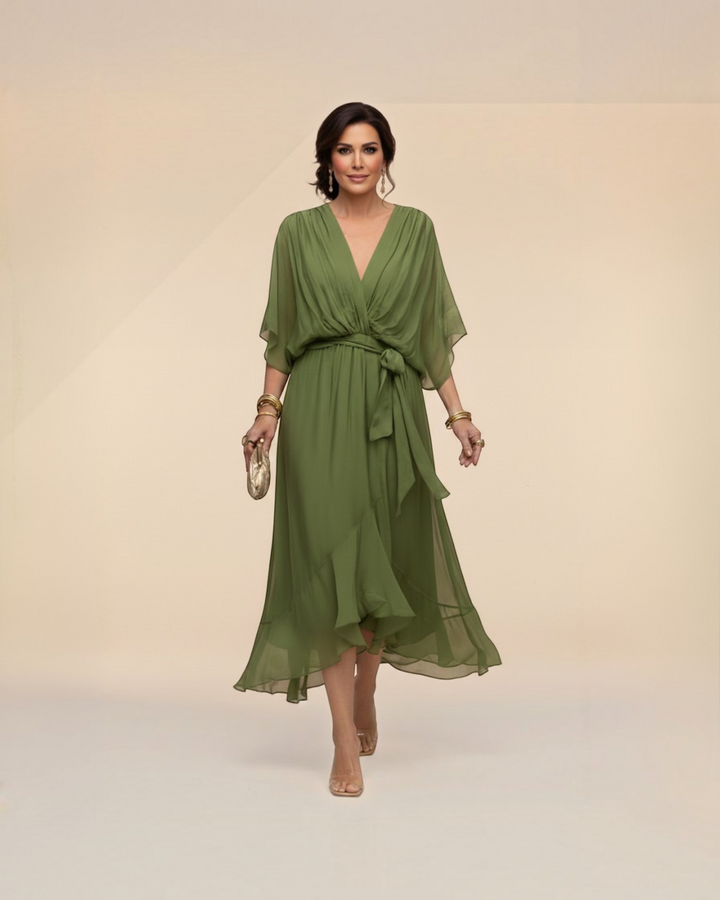 Luna Moda Monica olive green chiffon midi dress with V-neck and tie waist worn by a woman on a neutral background