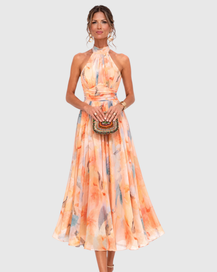 Luna Moda Aurora maxi dress with halter neck and artistic watercolor print in soft orange and blue tones