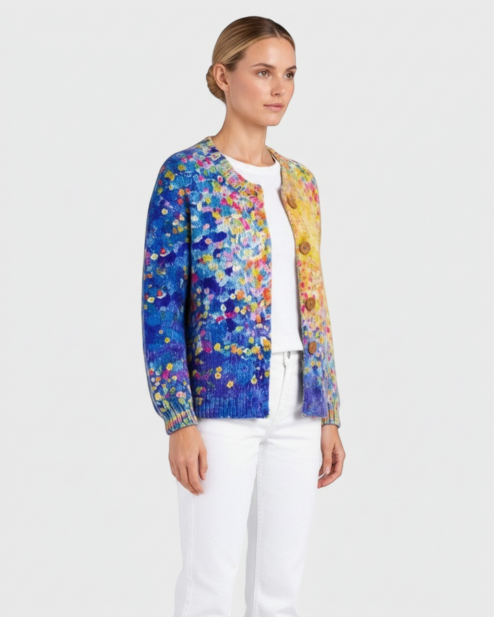 Luna Moda floral patchwork cardigan with wooden buttons worn by a model over a white top and trousers.