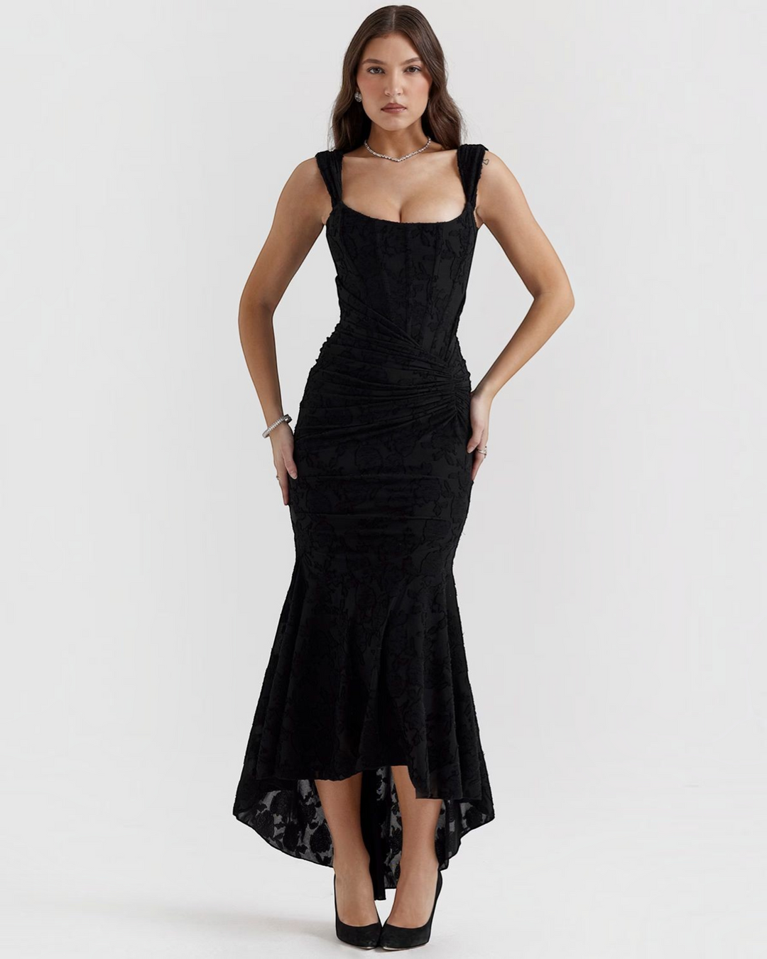 Luna Moda Katerina black midi dress with corset bodice, ruched waist, and high-low hem in floral textured fabric.