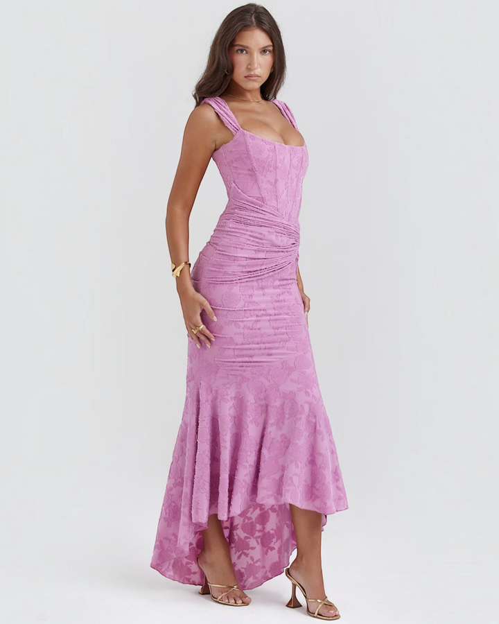 Luna Moda Katerina pink floral midi dress with a corset-style bodice, ruched waist, and high-low hemline on a model.