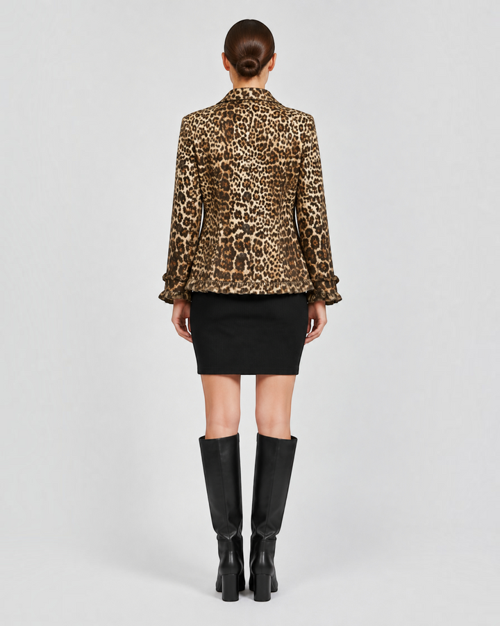 Luna Moda Giuliana leopard print jacket with ruffled hem and cuffs, back view on a model wearing a black skirt.