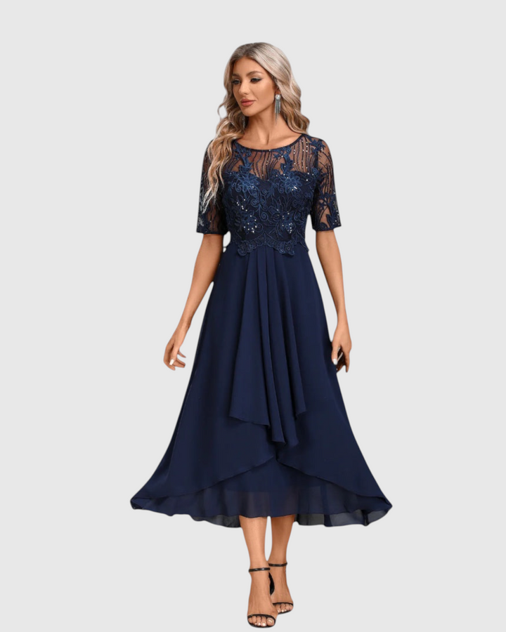 Luna Moda navy blue midi dress with short lace sleeves, sheer bodice, and flowing skirt for formal occasions.