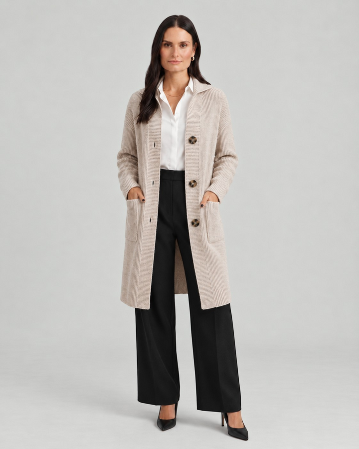 Luna Moda Chiara long beige ribbed knit cardigan with button closure and front pockets worn by a model