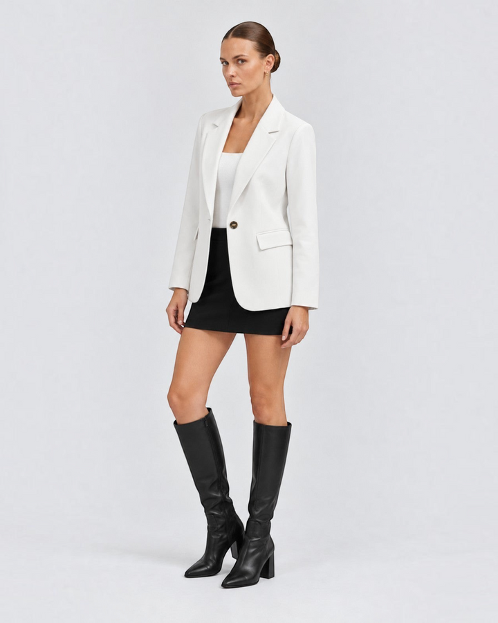Luna Moda Margarida classic white premium blazer worn by a model with a black mini skirt and knee-high boots
