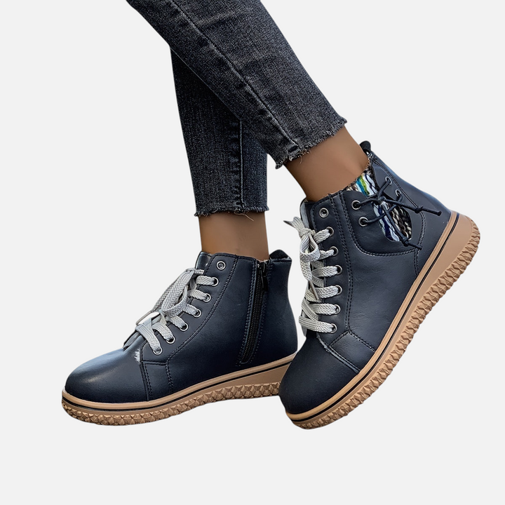 Luna Moda EDUARDA black leather ankle boots with grey laces and a textured tan rubber sole worn with dark jeans