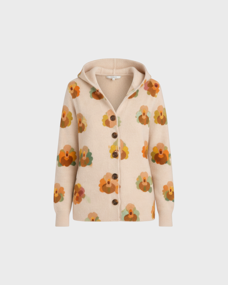 Luna Moda beige knit cardigan featuring a hood and a vibrant orange and green floral pattern with button-up front.