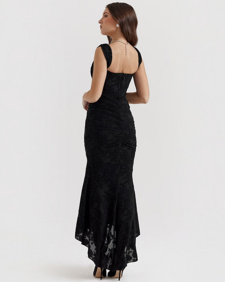 Luna Moda Katerina black floral textured midi dress with a fitted bodice and ruched back detail on a model