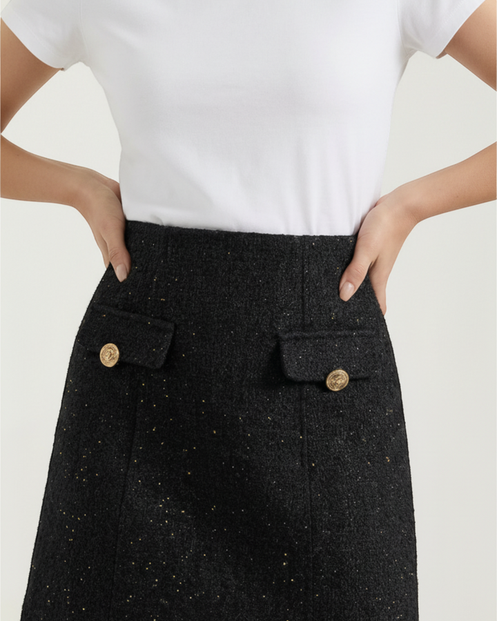 Luna Moda Tasha black textured mini skirt with gold button details and functional pockets on a model
