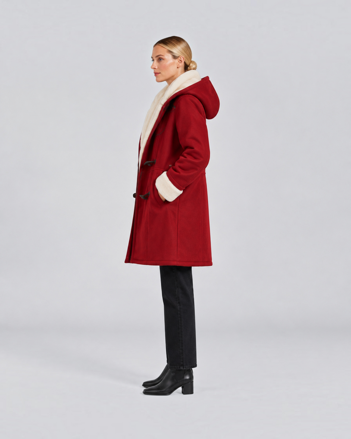 Luna Moda Antonia red hooded winter coat with toggle closures and cream faux fur lining worn by a woman