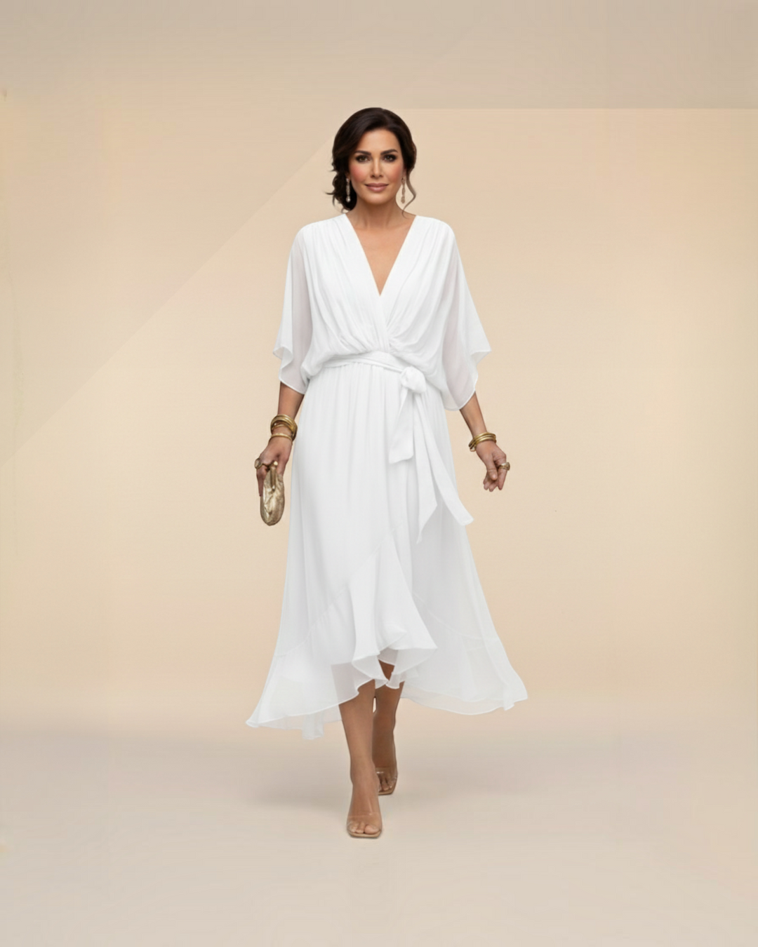 Luna Moda Monica white chiffon midi dress with V-neck, flutter sleeves, and tie waist worn by a woman in heels.
