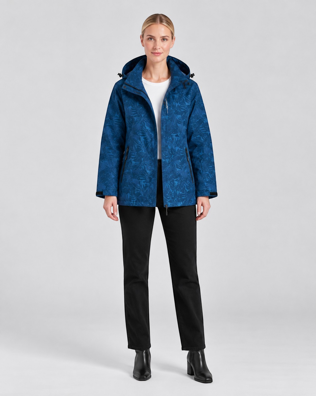 Luna Moda blue waterproof hooded jacket with a subtle leaf pattern worn by a model against a plain background.