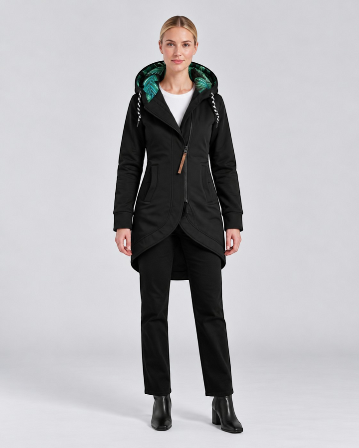 Luna Moda LEONILDA black fitted coat with a green tropical print hood lining and asymmetrical zipper closure