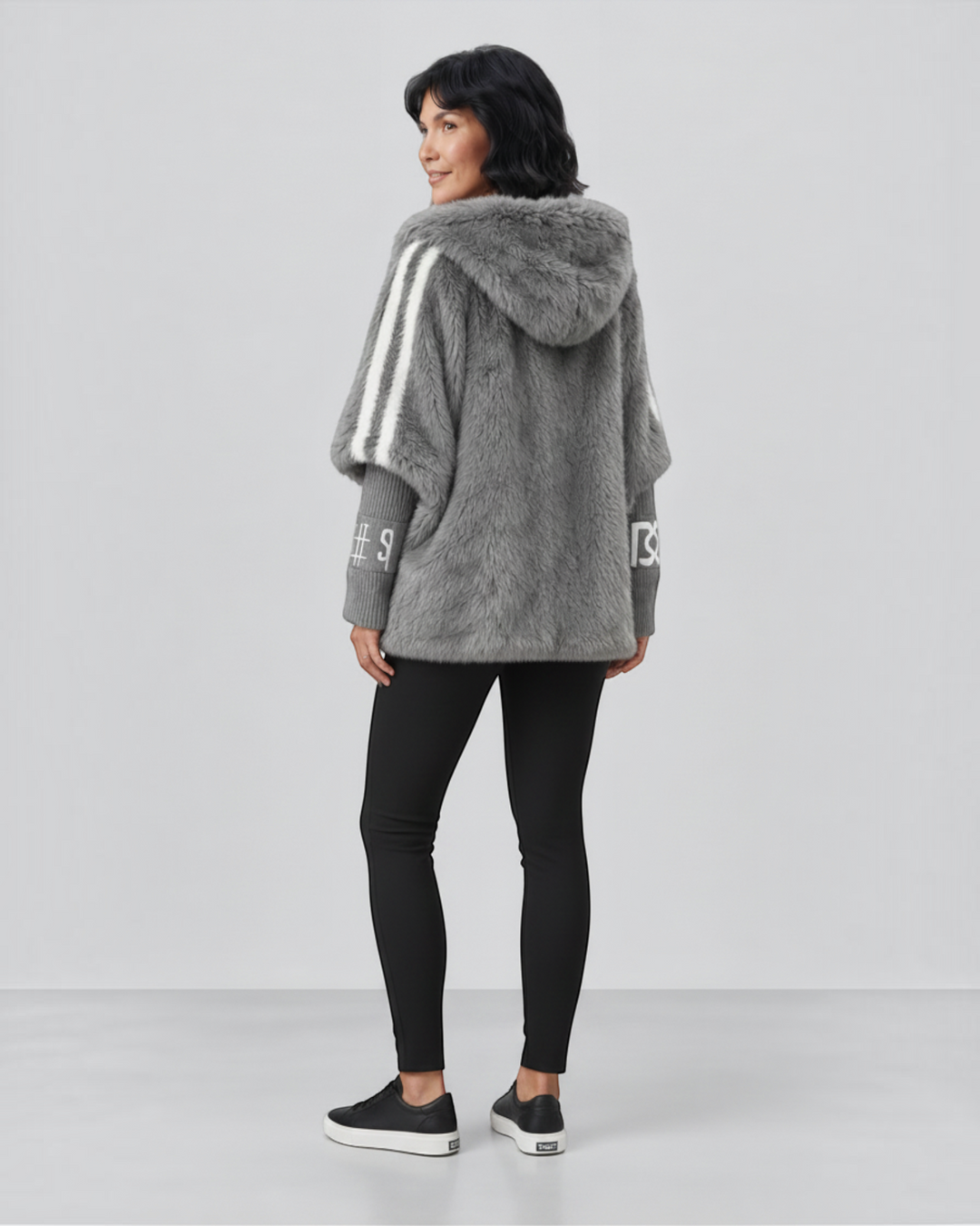 Luna Moda grey faux fur hooded jacket with white striped shoulder details and ribbed cuffs worn by a woman.