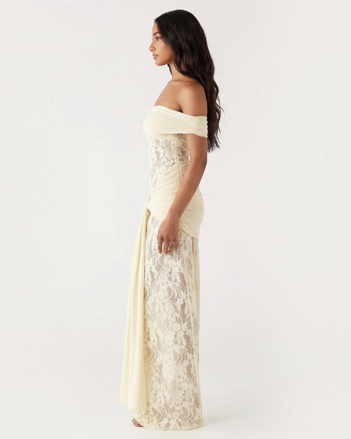 Luna Moda off-the-shoulder cream lace maxi dress with draped waist detail worn by a model in a side profile view