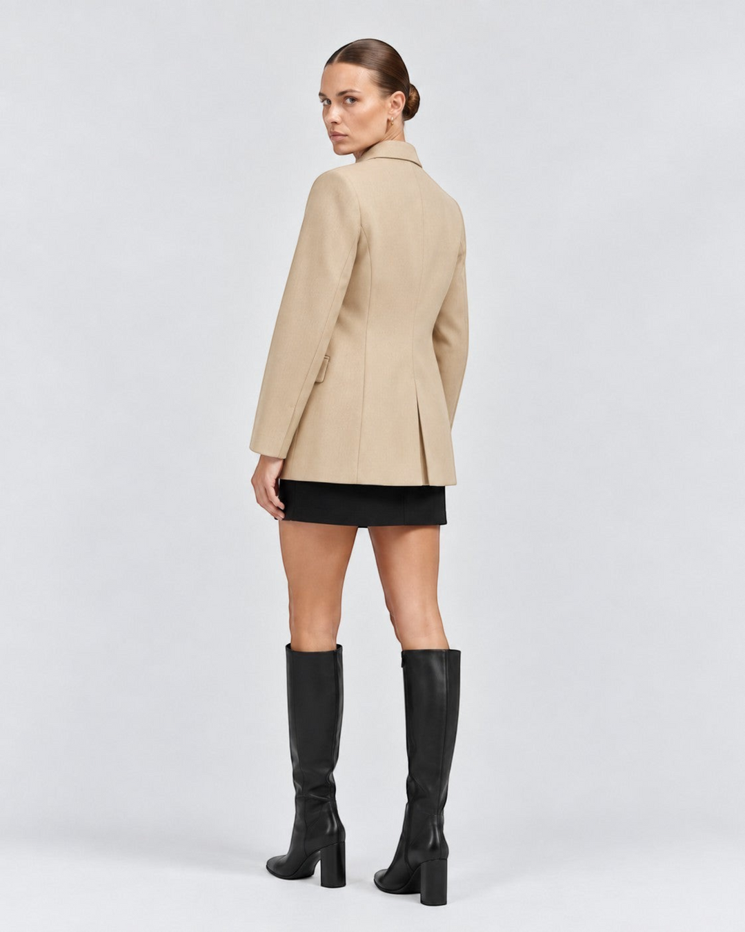 Luna Moda beige premium fabric blazer with classic tailored fit worn by a model with black skirt and knee-high boots