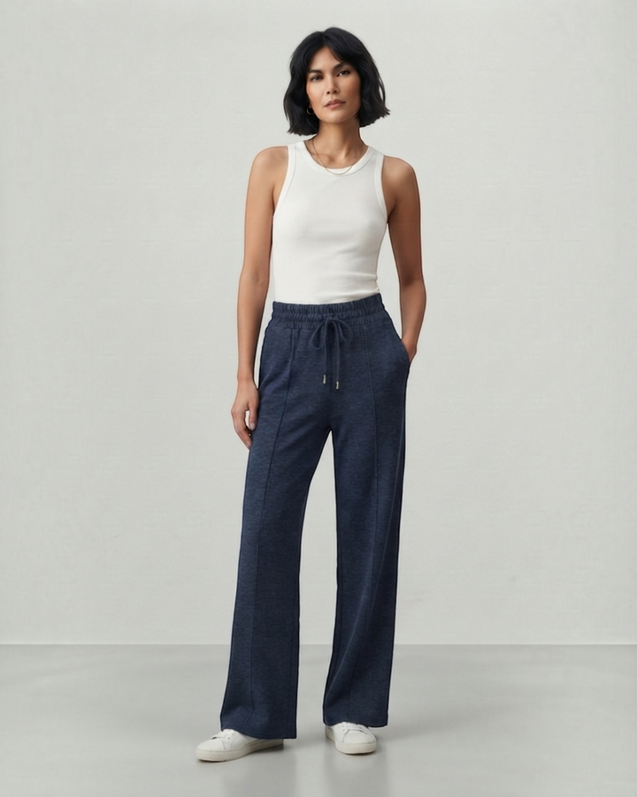 Luna Moda Ada high-waisted navy palazzo pants with drawstring waist and front seam detail worn by a model