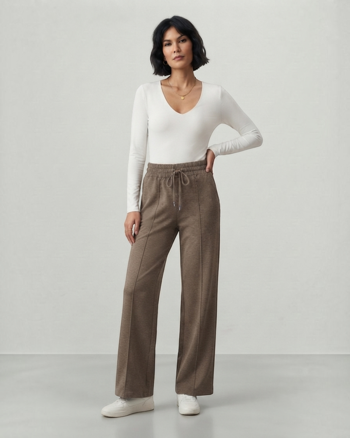 Luna Moda Ada high-waisted brown palazzo pants with drawstring waist and front seam detail worn by a model