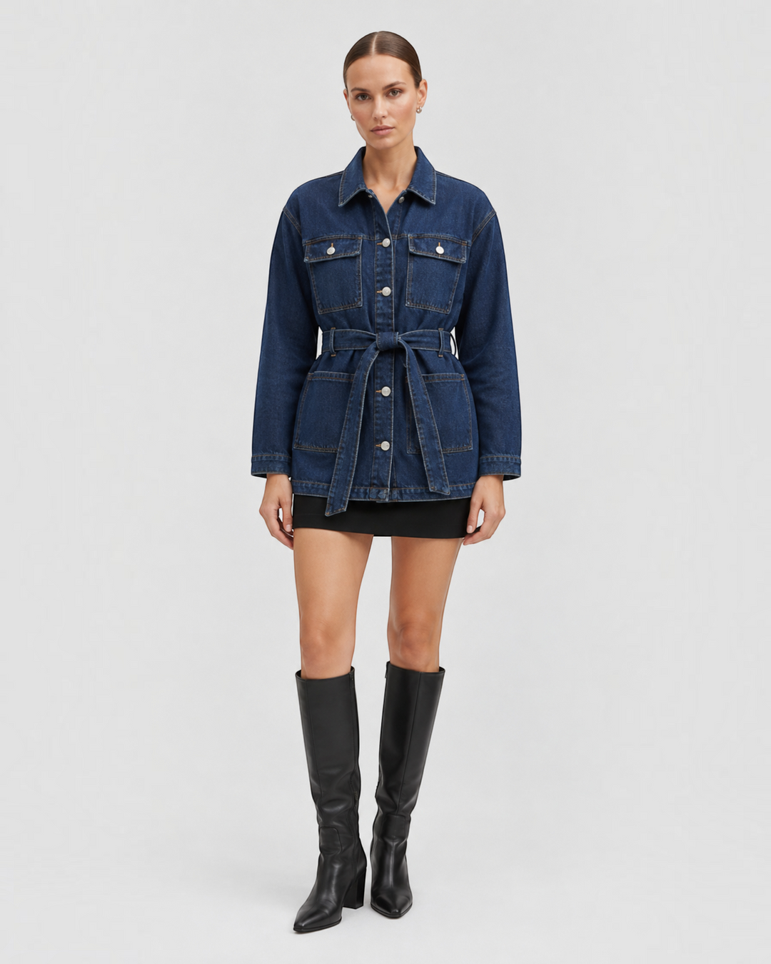 Luna Moda Alice relaxed fit dark blue denim jacket with a waist belt, worn by a model with black boots.