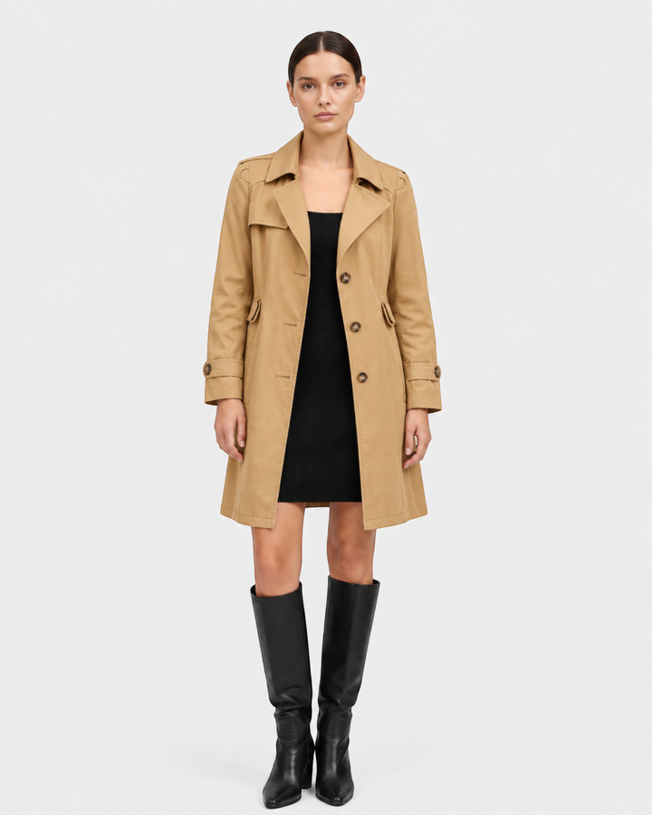 Luna Moda Annunziata lightweight beige flared trench coat worn by a model with a black dress and knee-high boots