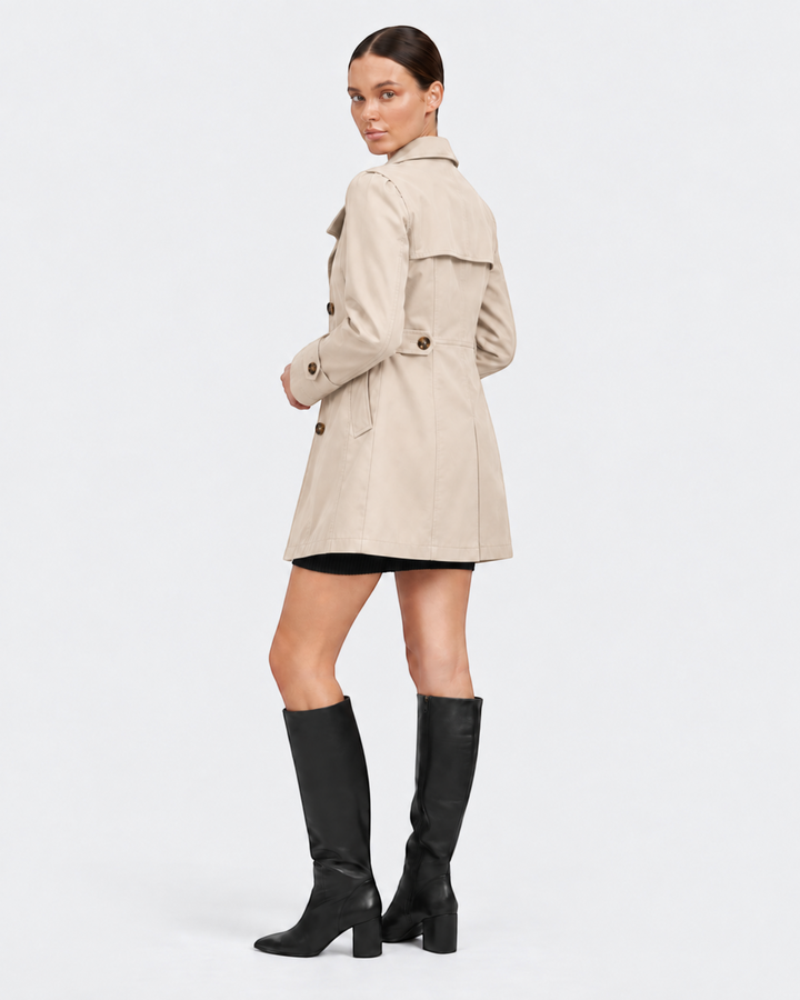 Luna Moda Annunziata lightweight beige flared trench coat worn by a model with black knee-high boots
