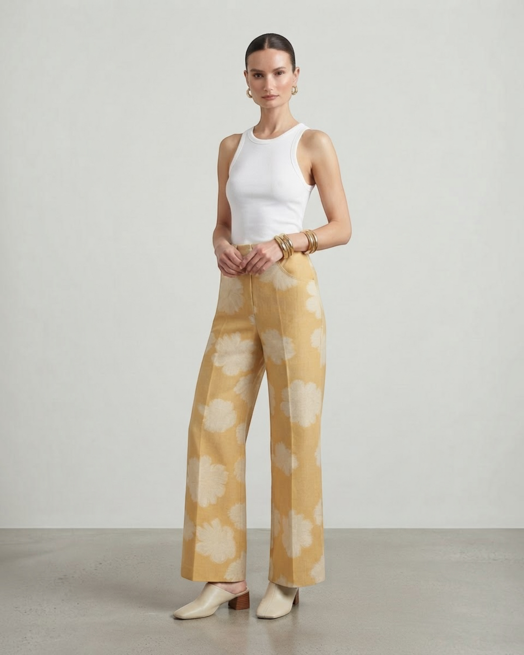 Luna Moda wide-leg lounge pants in yellow with a white floral print, paired with a white tank top and mules.