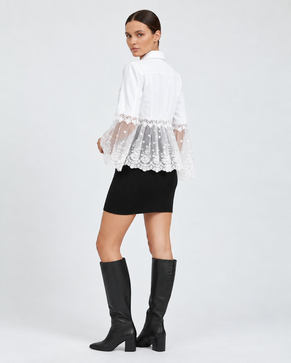Luna Moda Elisabetta white jacket with floral lace shoulders and sheer embroidered tulle hem worn by a model