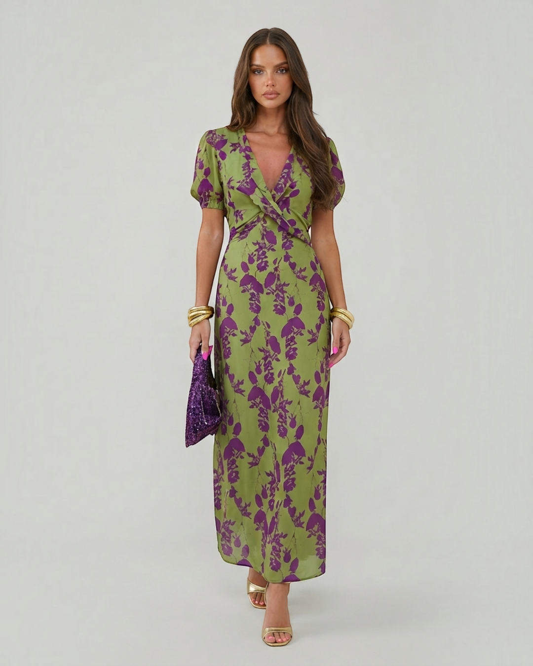 Luna Moda Andrea summer midi dress in green with purple floral print, V-neck, and short puff sleeves on a model.