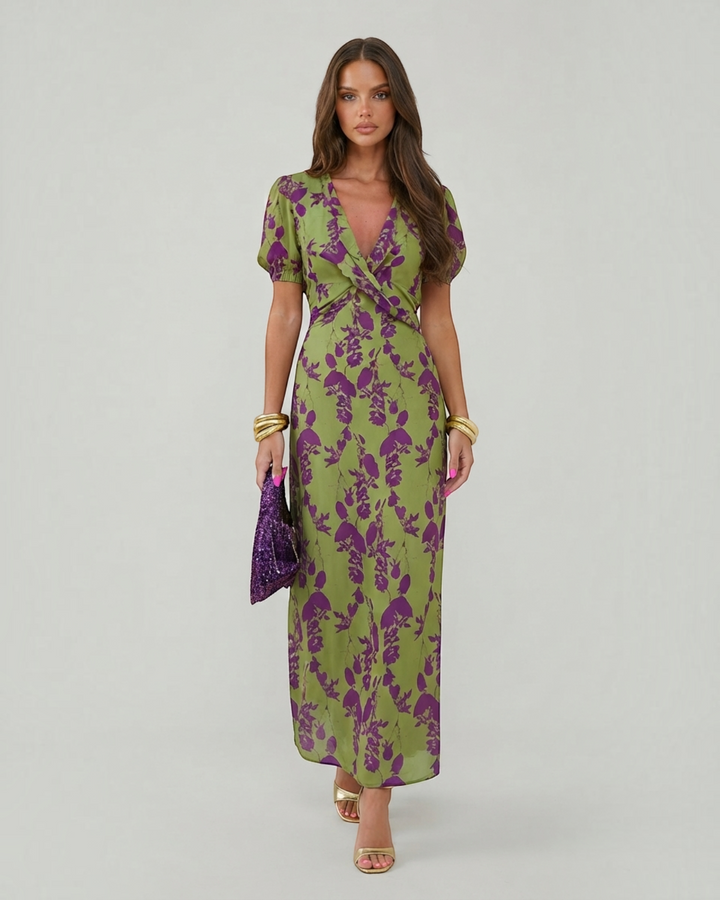 Luna Moda Andrea summer midi dress in green with purple floral print, V-neck, and short puff sleeves on a model.