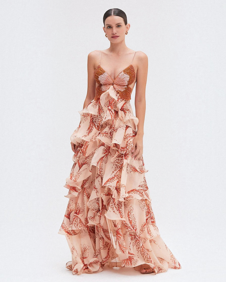 Luna Moda Nahia bohemian maxi dress with ruffled skirt, butterfly-shaped beaded bodice, and floral print in peach