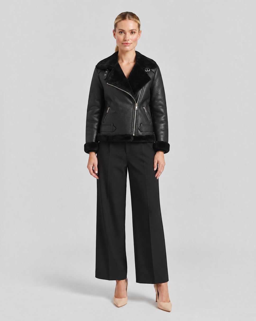 Luna Moda Claudia black fleece-lined jacket with zip details and waist belt worn by a model
