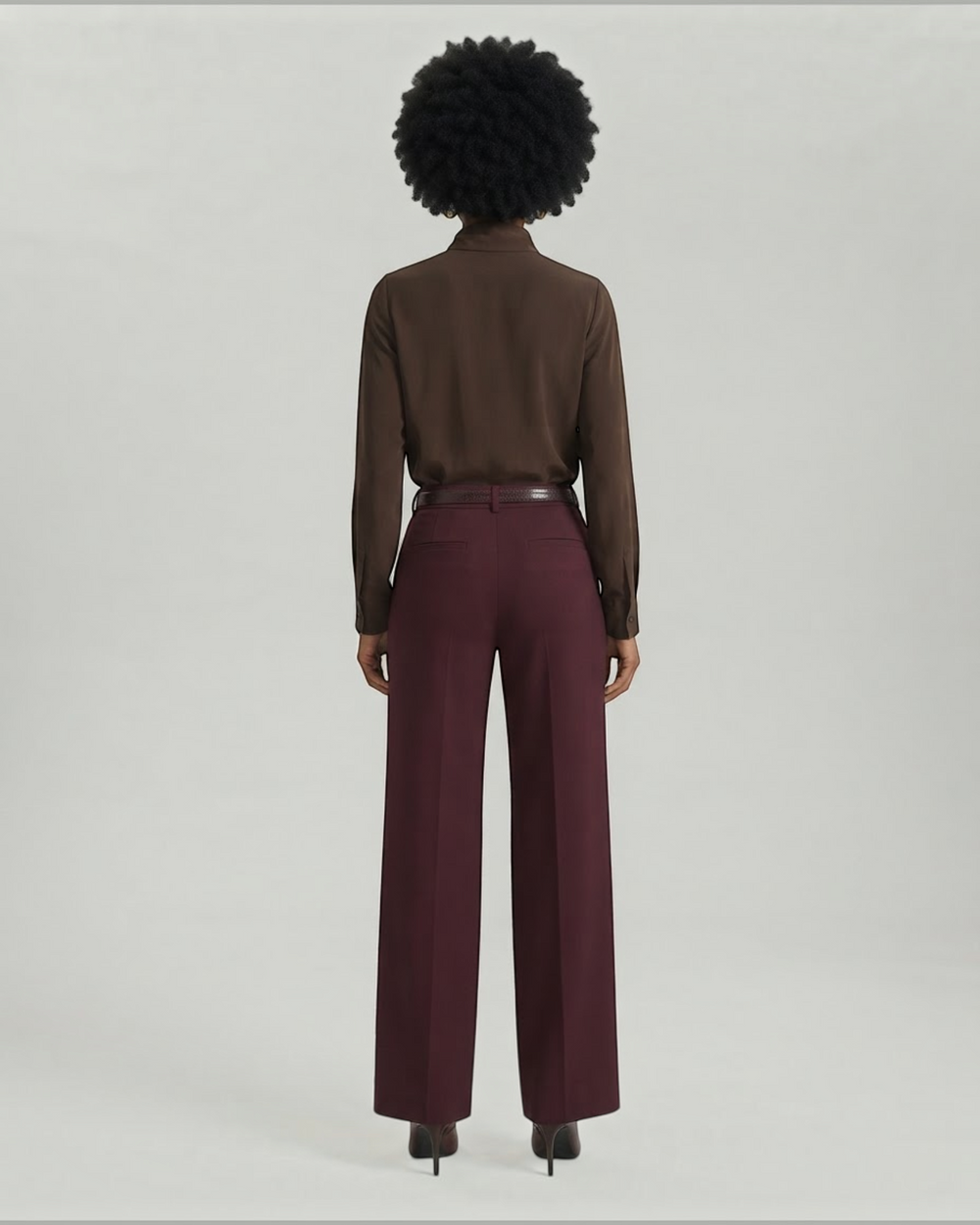 Luna Moda palazzo trousers in burgundy with a matching belt, worn by a model with a dark brown shirt, back view