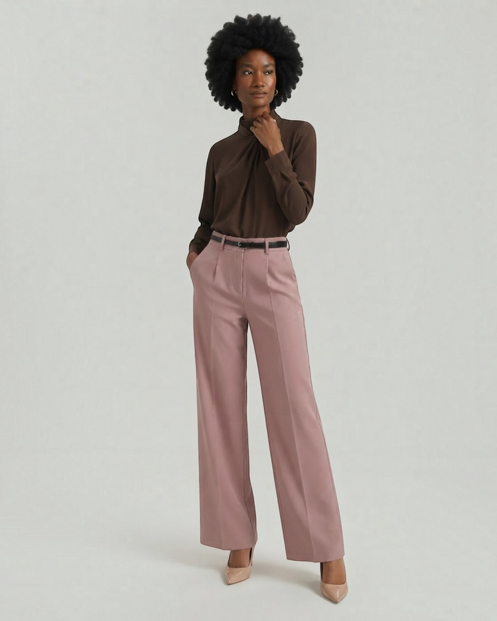 Luna Moda Bertha palazzo trousers in dusty pink with front pleats and a matching belt worn by a model