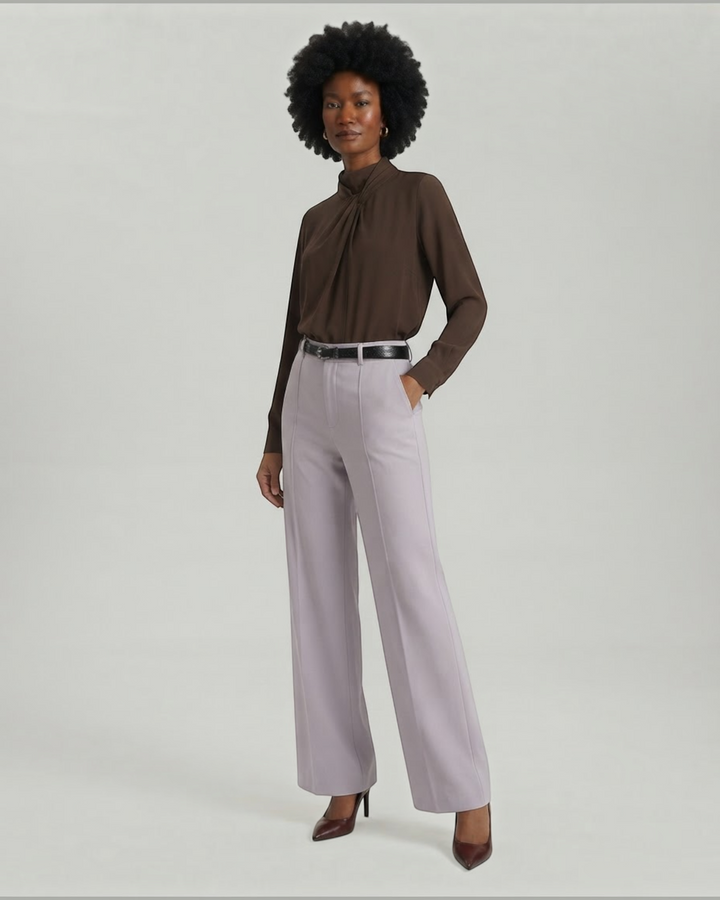 Luna Moda Bertha palazzo trousers in light lilac with front pleats and a matching belt worn by a model