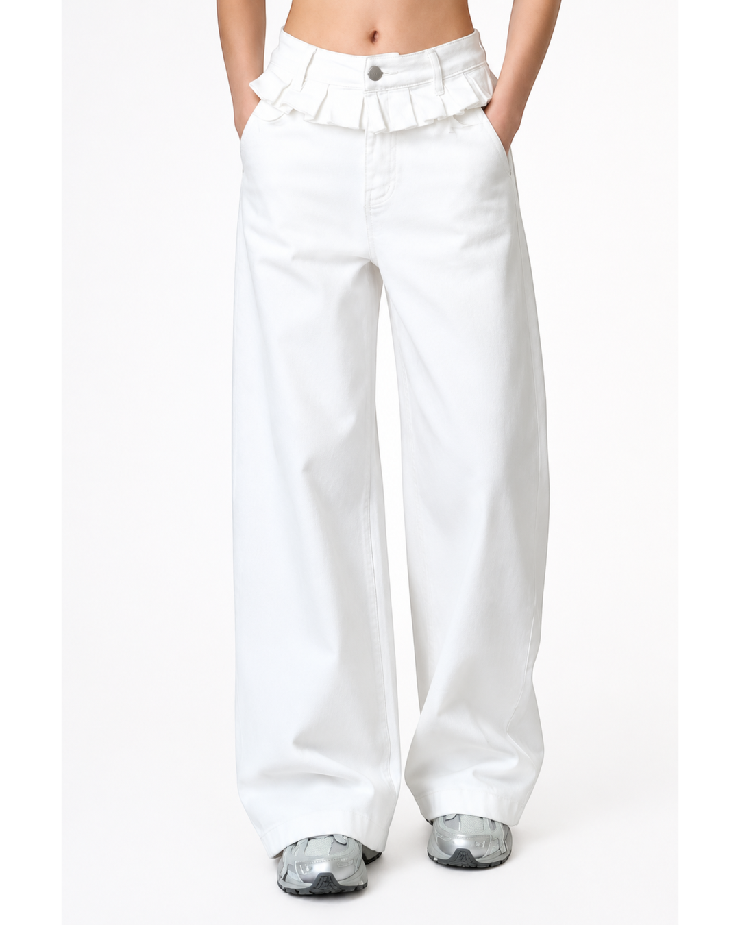 Luna Moda white wide-leg jeans featuring a decorative ruffled waist detail, worn with grey sneakers.