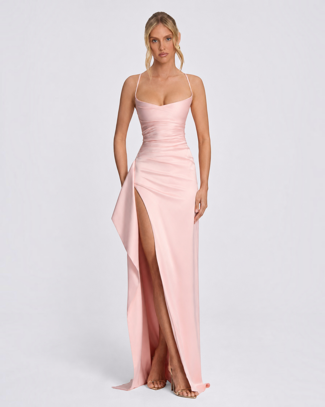 Luna Moda pink satin maxi dress with a high slit, delicate crisscross straps, and a sleek, form-fitting silhouette.
