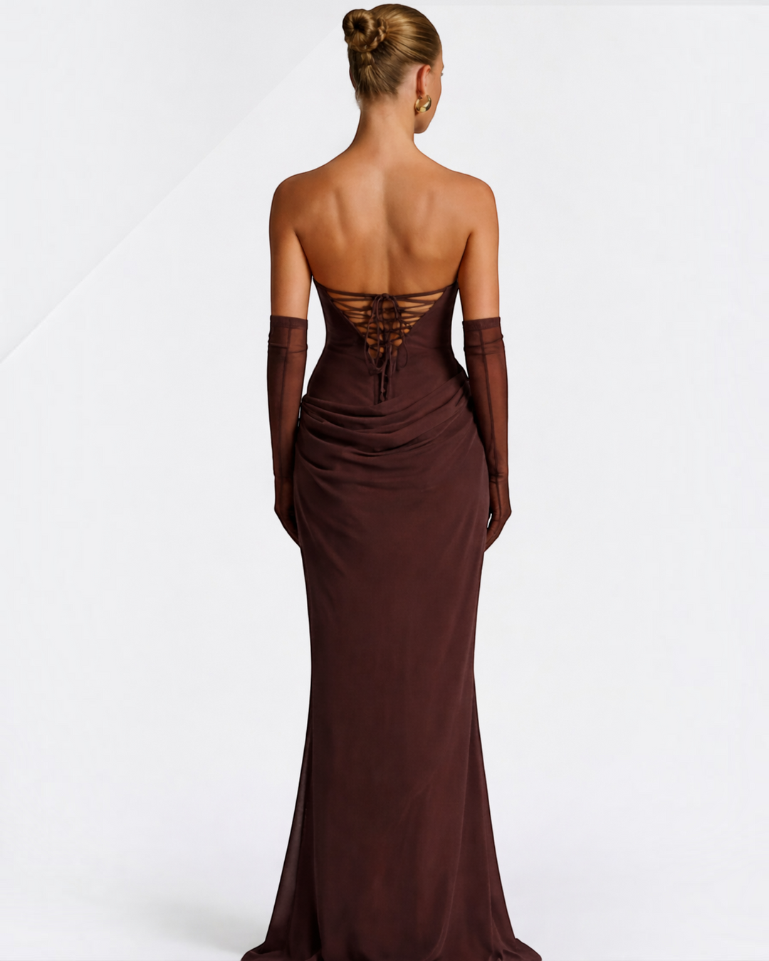 Luna Moda brown maxi dress with a strapless corset back, featuring soft draping and a sculpting silhouette.